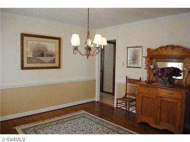 Dining Room - Hardwood floor, chandelier, chair mo