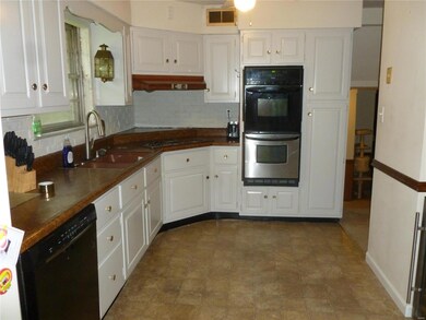 New double ovens space for kitchen table & chairs