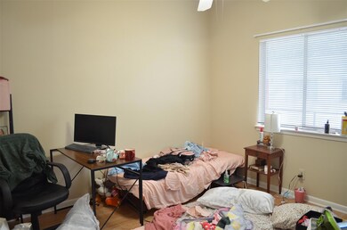 Bedroom featuring wood finished floors and an off