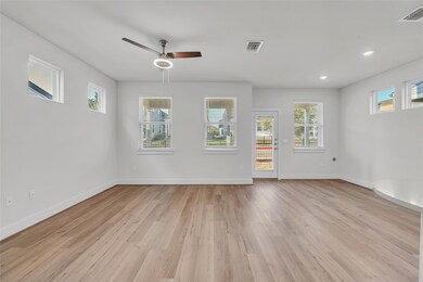 Unfurnished living room with ceiling fan, light w