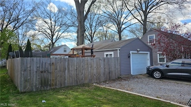 Driveway is cement, extra gravel parking. Privacy fence added 2022.