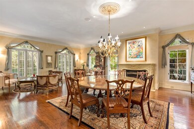 Dining Room with fireplace. Large enough to accommodate two tables. 