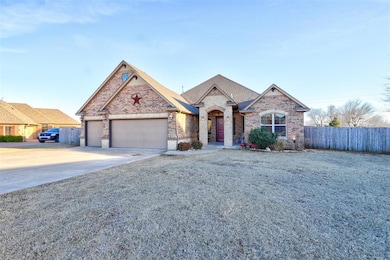 French country style house with driveway, a garage