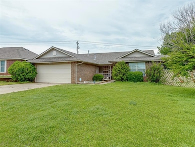 Ranch-style home featuring roof with shingles, bri
