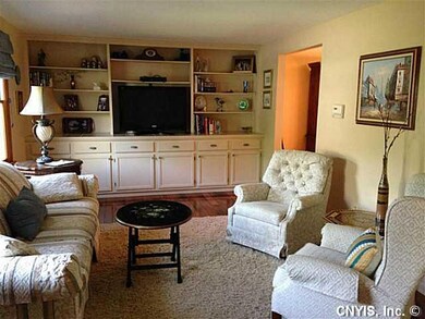 Living Room. Distressed Hickory hard woods throughout living and dining rooms. Built in shelving add so much to this room!