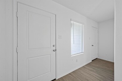 Foyer entrance featuring light hardwood / wood-sty