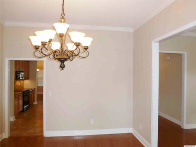 The formal dining room has hardwood floors and ten foot smooth ceilings.