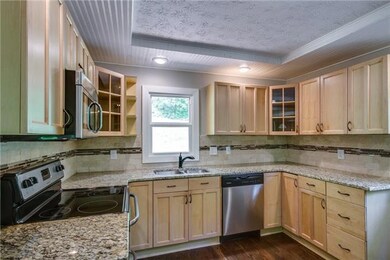 Totally remodeled kitchen, granite counters, stainless steel appliances