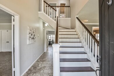 Hardwood staircase greets you in the entryway.