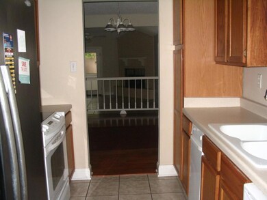 Galley Kitchen has tile floor - view from kitchen