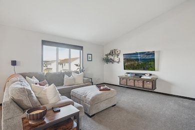 Spacious living room with open flow to kitchen and dining for easy entertaining