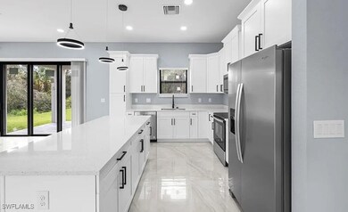 Kitchen with appliances with stainless steel finis