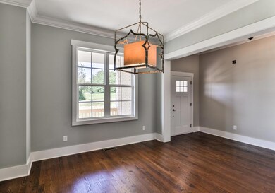 Notice the unique chandelier in the dining room