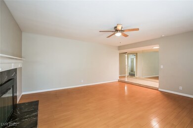 Unfurnished living room with baseboards, a ceiling