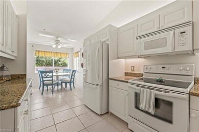 Kitchen featuring light tile patterned floors, whi