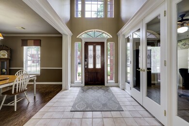  High ceilings, large windows, and exquisite finishes enhance the home's contemporary charm.