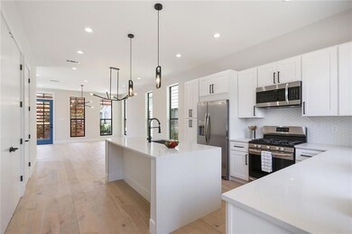 Large kitchen with island seating & infinity quart