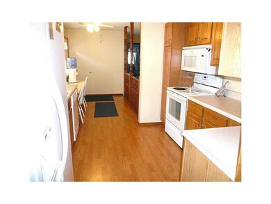 Kitchen. Galley kitchen and there is a little brea
