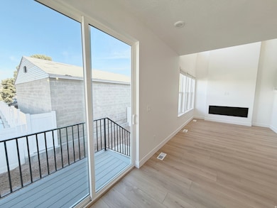 Corridor featuring baseboards and light wood finished floors