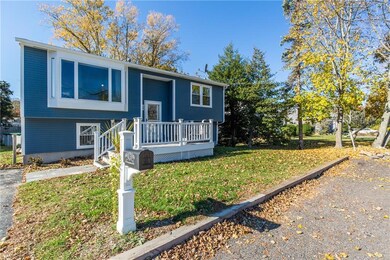Front yard and parking area in front of house