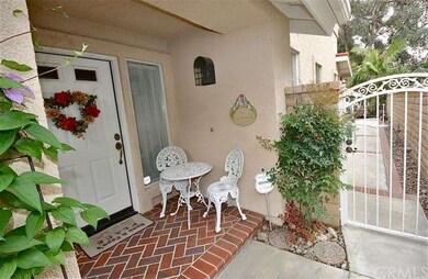 Covered entry with brick set in herringbone patter