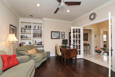 French doors and built-in shelves add the finishing touches to the office.