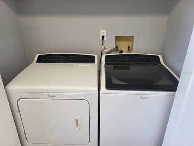 Washer and Dryer in Laundry closet in the kitchen.