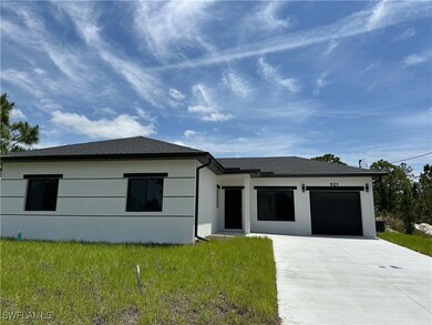 Prairie-style home with stucco siding, a front yar