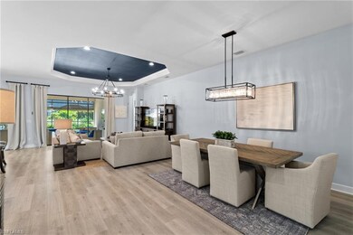 Living area with a raised ceiling, wood finished f