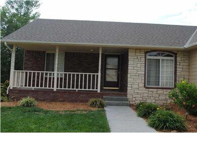 Covered front porch welcomes you home into this 5 