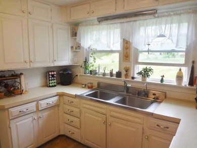 Kitchen. Overlooking the back yard