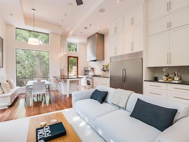 Living room with light wood-type flooring and rec
