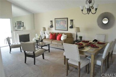 View of Dining area and Living Room with Fireplace