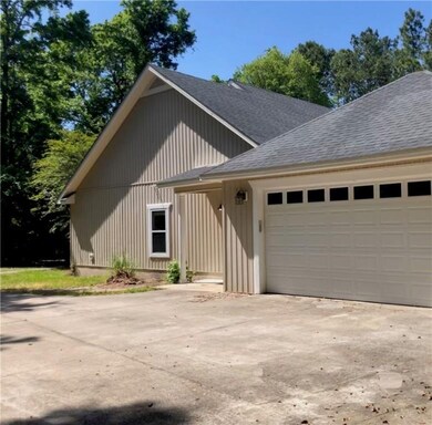 Two-car garage entry to hallway with laundry room