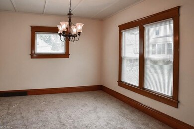 Formal dining room with wide baseboards.
