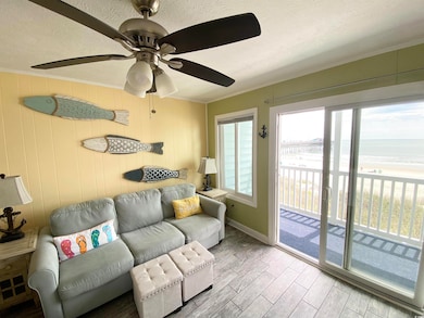 Living room featuring a textured ceiling, baseboar