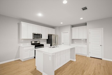 Kitchen with appliances with stainless steel fini