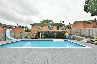 The in-ground pool and large pool deck