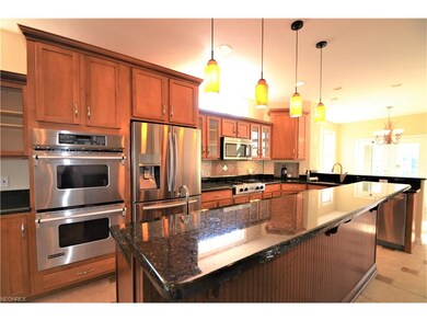 Over-sized island providing a second sink in the k