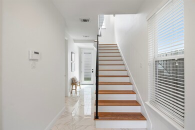 Upon entry, you're welcomed by a spacious first-fl
