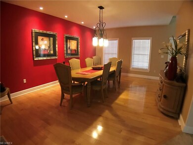 Formal dining room with beautiful lighting and map