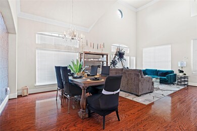 Dining area with ornamental molding, hardwood / wo