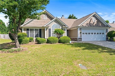View of front of property featuring an attached ga