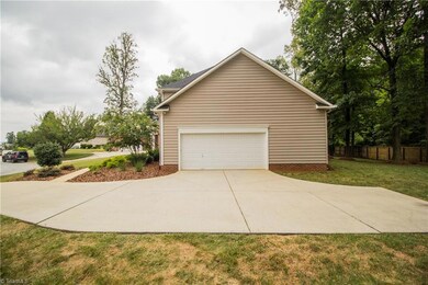 Side entrance two car garage with extra parking pad