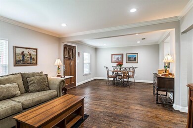 The hand scraped hardwoods extend throughout the h