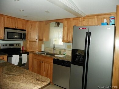 Kitchen with granite counter tops, stainless steel