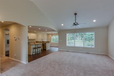 Vaulted ceiling, adjacent and open to kitchen