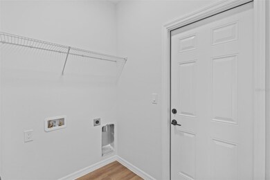 Laundry room, located off the garage