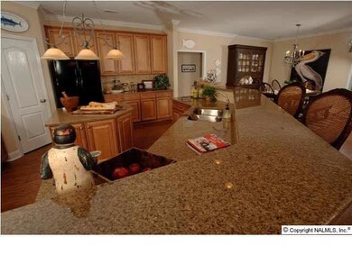 Large Bar with Granite, Large prep island, plenty of cabinets, double ovens, stainless appliances are just a few of the wonderful things you will find in this kitchen! Pictures of a Tucker model home