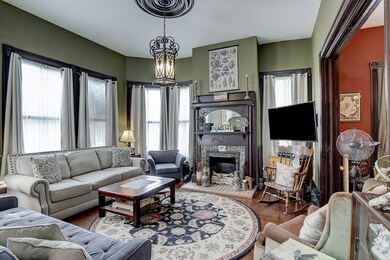 Front living room with the large bay windows to th